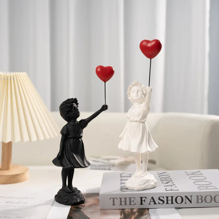 Sculpture of a girl with balloon in Banksy style for table decoration and creative living room decoration