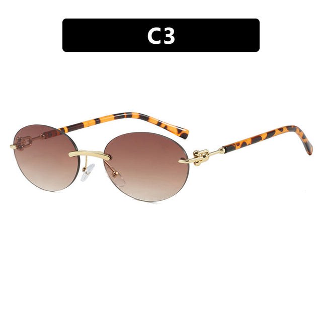 Women oval sunglasses with luxurious metal frame and mirrored lenses