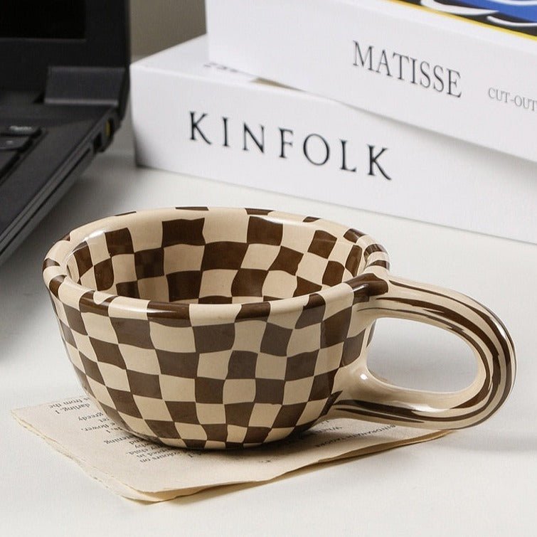 Ceramic mug with irregular checkerboard pattern