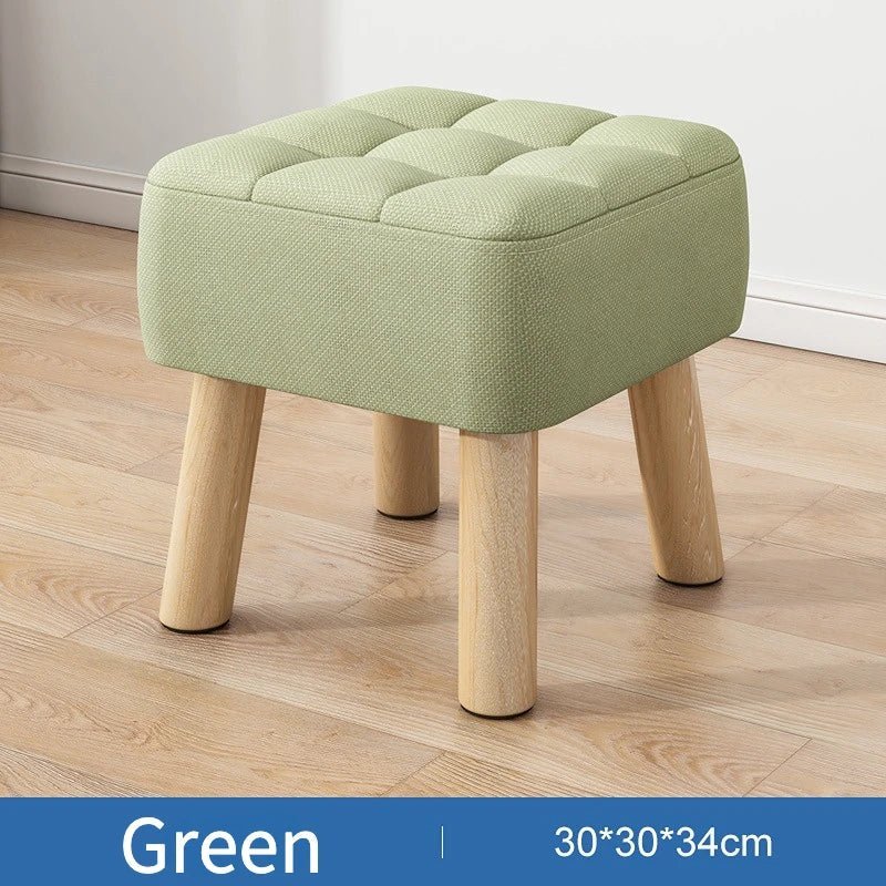 Padded ottoman stool in retro style in pastel colors
