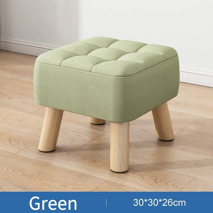 Padded ottoman stool in retro style in pastel colors