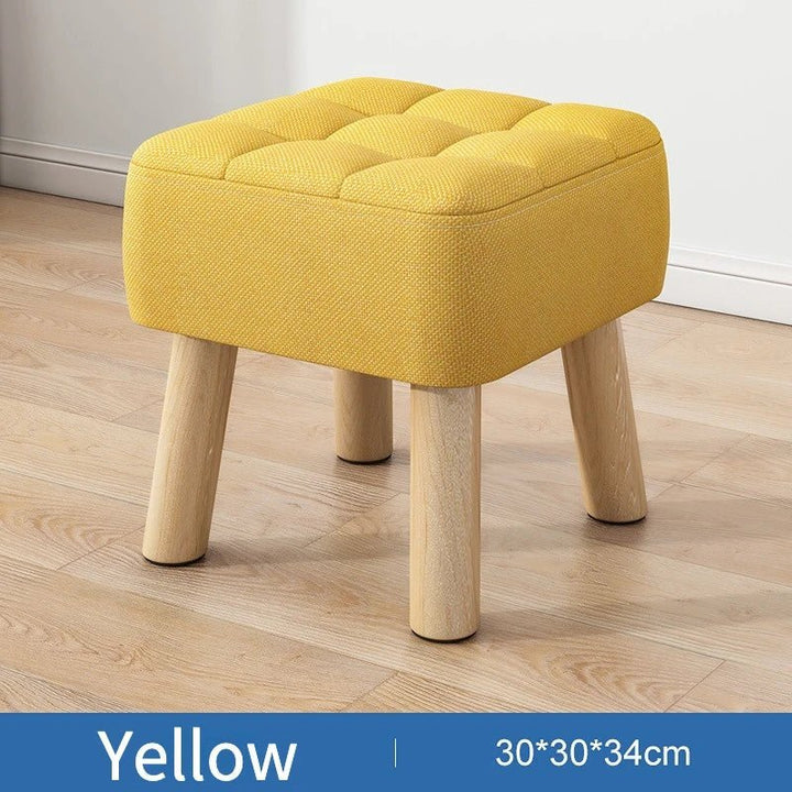 Padded ottoman stool in retro style in pastel colors